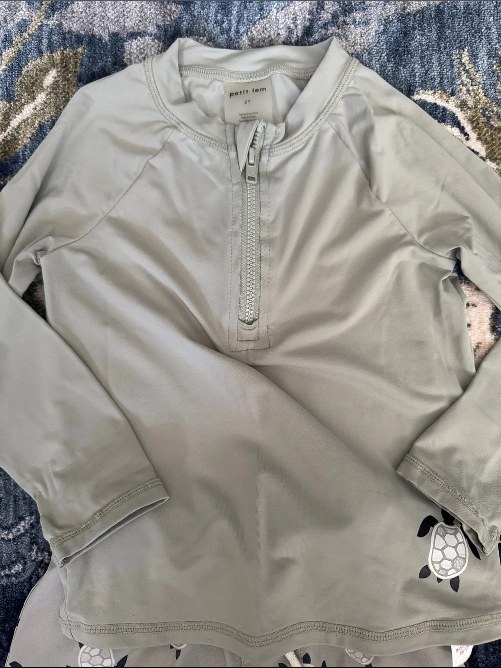 Petit Lem EUC Green Turtle Swim trunks and rashguard.